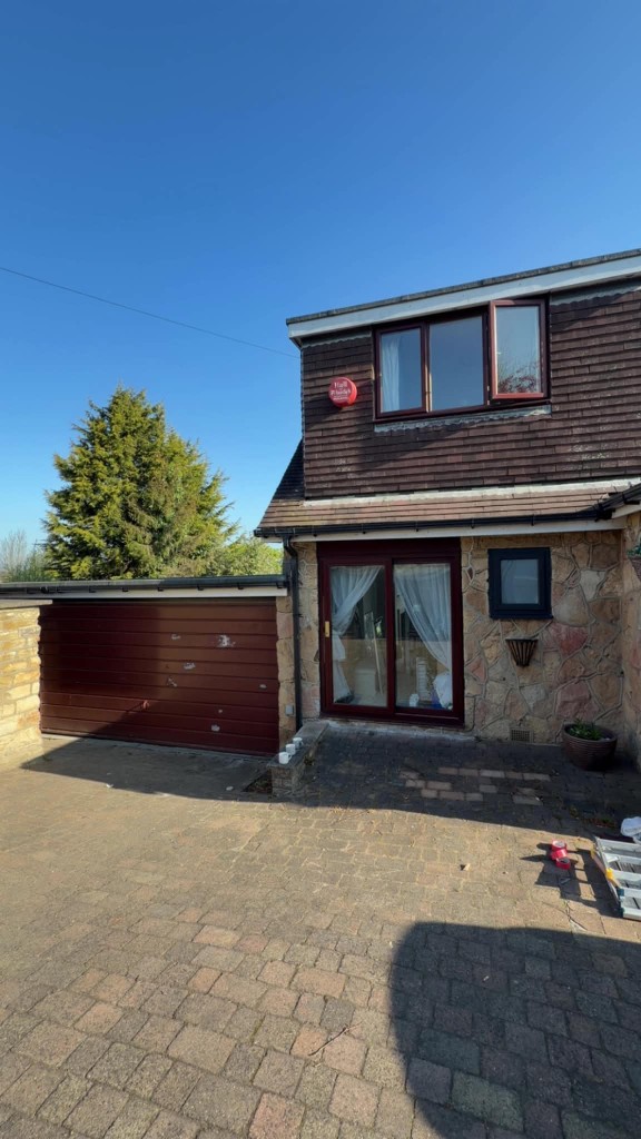 Burgundy windows, sliding doors and garage before spraying